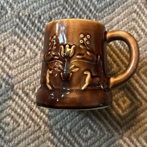 Two vintage stone wear mugs possibly Hull or McCoy With deer & flowers